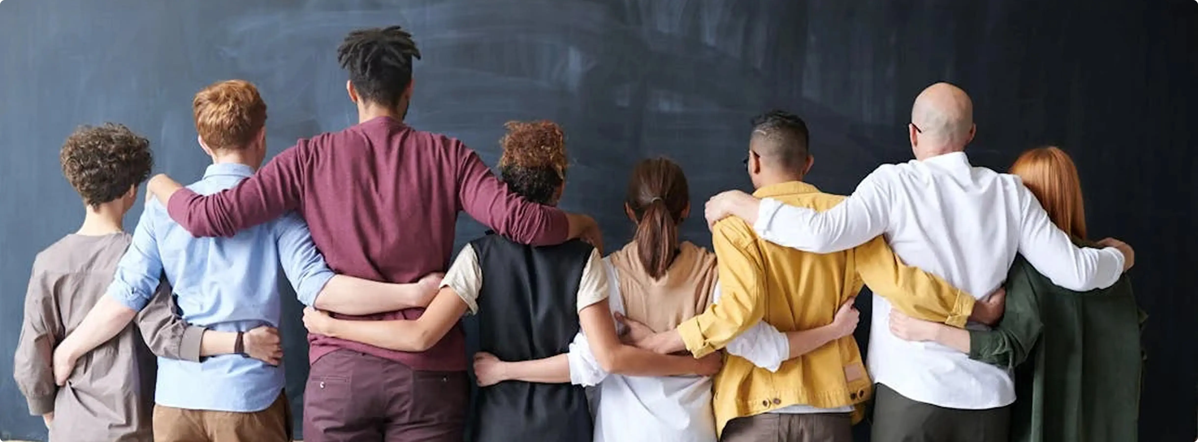 people hanging their hands on shoulder